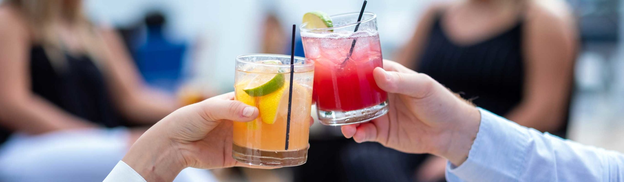 Image of two drinks held by Pier 290 customers